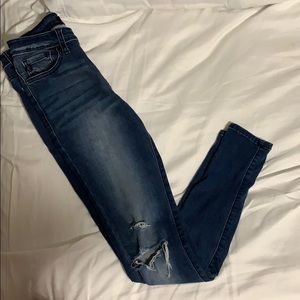 Medium dark washed, distressed skinny jeans.